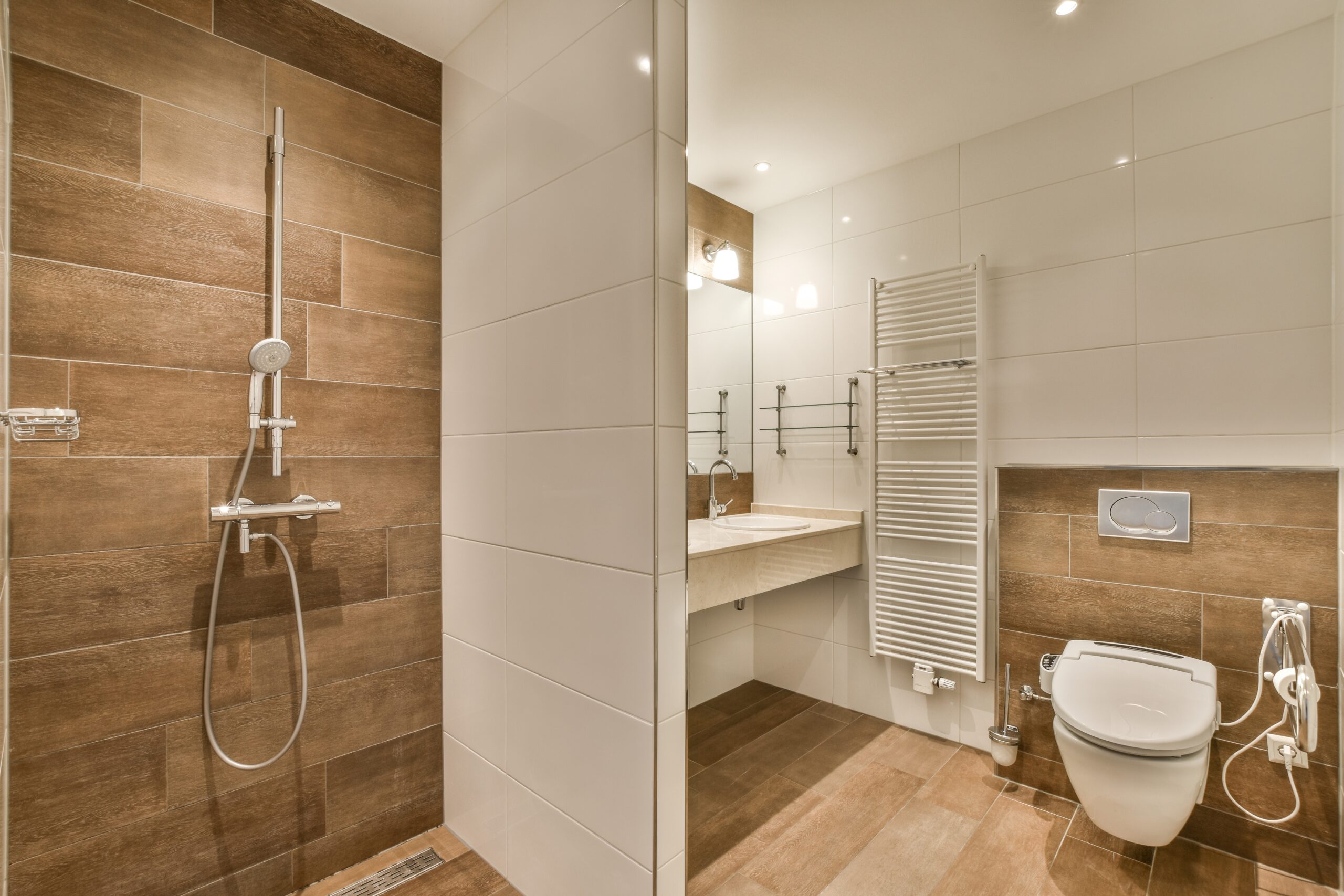 A,Modern,Bathroom,With,Wood,Flooring,And,White,Tiles,On